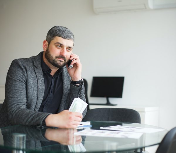 business-man-sitting-at-the-desk-and-signing-contract-man-takes-bribe-for-signing-the-contract-.jpg